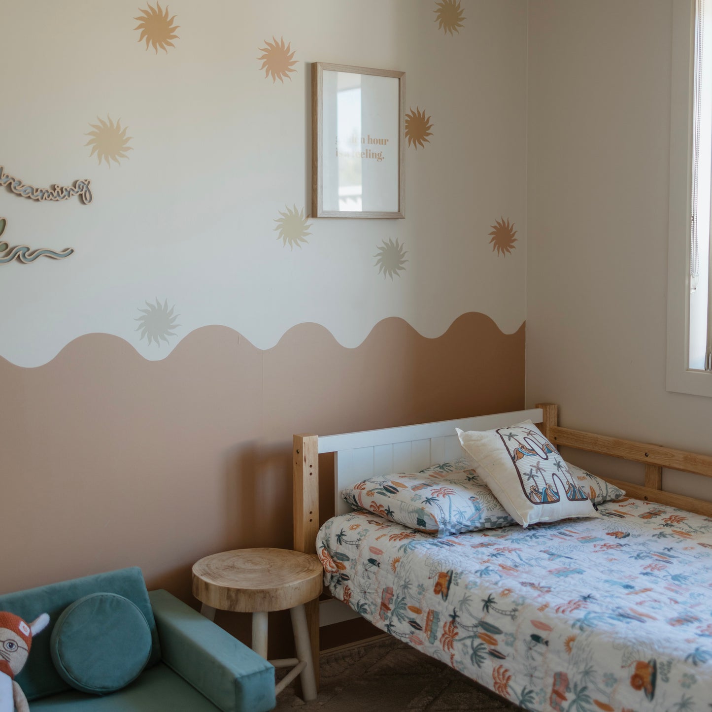 kids bedroom with warm wavy wall removable wallpaper and retro sun decals